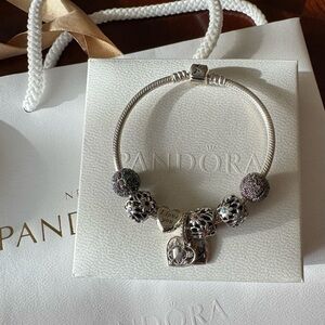 Pandora bracelet with 7 charms - worn once
